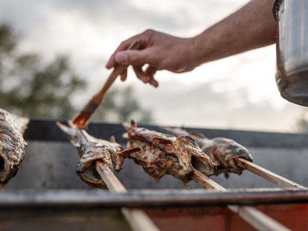 Roasted fish spits directly at the river bank